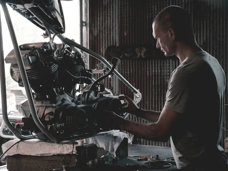 Auto repair mechanic inspecting a vehicle